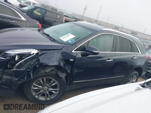 2021 Cadillac XT5 FWD Premium Luxury with VIN 1GYKNCRS2MZ185678, listed as a IAAI auction lot 41143084 with 25,399 mi miles and . Bid and sale history available at carsss.com. Image 14.