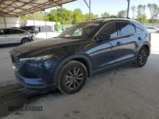 2021 Mazda CX-9 Touring z VIN JM3TCACY7M0528188, wystawiony jako Copart lot #53880865 z przebiegiem 63 581 mil mil oraz Szkoda całkowita • Salvage title. Historia ofert i sprzedaży dostępna na DreamBid. Obrazek 1.