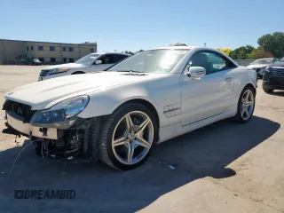 2009 Mercedes-Benz SL 550 с VIN WDBSK71F69F147589, выставлен на аукционе Copart как лот 65976995 с пробегом 77 387 миль миль и Списание • Salvage title. История ставок и продаж доступна на DreamBid. Изображение 1.