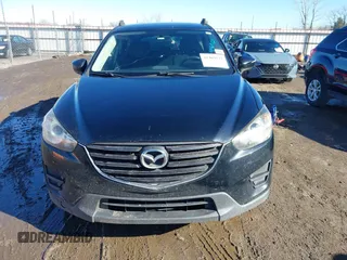 2016 Mazda CX-5 Sport with VIN JM3KE4BY0G0662294, listed as a IAAI auction lot 41469721 with 127,116 mi miles and . Bid and sale history available at carsss.com. Image 12.