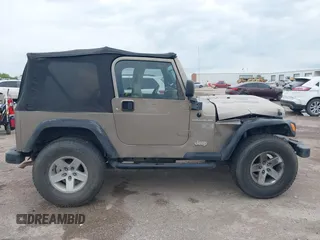 2005 Jeep Wrangler X with VIN 1J4FA39S55P350696, listed as a IAAI auction lot 42367283 with 117,941 mi miles and . Bid and sale history available at DreamBid. Image 13.