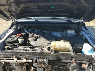 2018 Nissan NV Cargo S z VIN 1N6BF0KM4JN809929, wystawiony jako Copart lot #70578344 z przebiegiem 141 309 mil mil oraz Szkoda całkowita • Salvage title. Historia ofert i sprzedaży dostępna na DreamBid. Obrazek 13.