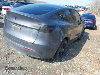 2023 Tesla Model Y Long Range with VIN 7SAYGDEE1PA053215, listed as a IAAI auction lot 41476973 with 58,025 mi miles and . Bid and sale history available at DreamBid. Image 4.