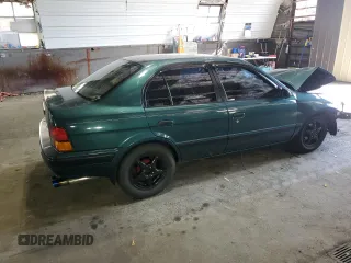 1996 Toyota Tercel DX z VIN JT2BC52L7T7044201, wystawiony jako Copart lot #77190074 z przebiegiem Nie podano mil oraz Szkoda całkowita • Salvage title. Historia ofert i sprzedaży dostępna na DreamBid. Obrazek 3.