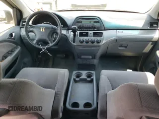 2007 Honda Odyssey LX with VIN 5FNRL38287B054504, listed as a Copart auction lot 59141665 with 128,617 mi miles and Salvage title. Bid and sale history available at DreamBid. Image 8.