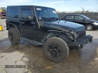 2017 Jeep Wrangler Willys Wheeler with VIN 1C4AJWAG1HL624254, listed as a Copart auction lot 42678975 with 51,936 mi miles and Salvage Title. Bid and sale history available at DreamBid. Image 4.