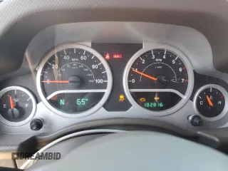 2010 Jeep Wrangler Unlimited Sahara with VIN 1J4BA5H11AL107228, listed as a Copart auction lot 54761705 with 102,816 mi miles and Clean Title. Bid and sale history available at carsss.com. Image 9.