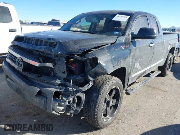 2014 Toyota Tundra 4WD Truck SR with VIN 5TFUM5F17EX051674, listed as a IAAI auction lot 41296906 with 140,782 mi miles. Bid and sale history available at carsss.com. Image 17.