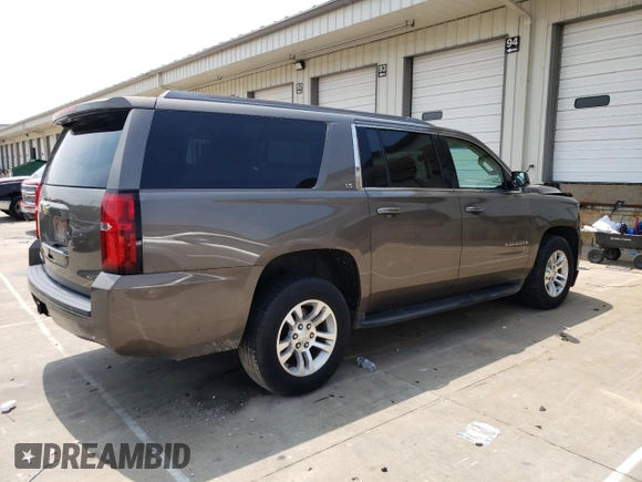 2015 Chevrolet Suburban LS with VIN 1GNSCHKC8FR628406, listed as a Copart auction lot 60682805 with 195,151 mi miles and Salvage title. Bid and sale history available at DreamBid. Image 3.