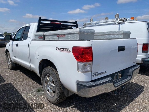 2011 Toyota Tundra with VIN 5TFUY5F1XBX198815, listed as a IAAI auction lot 42571444 with 281,114 mi miles and . Bid and sale history available at DreamBid. Image 4.