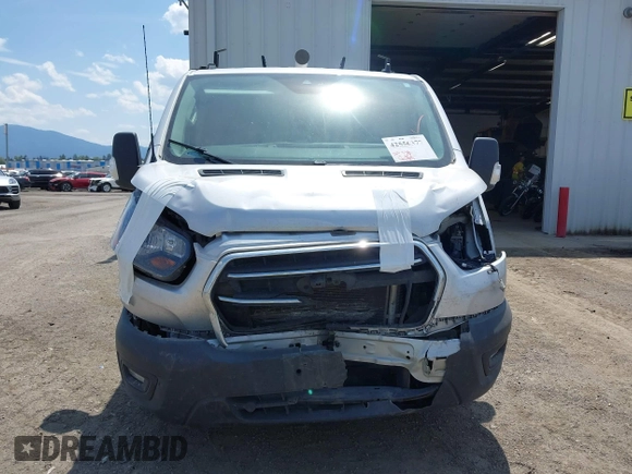 2020 Ford Transit Cargo z VIN 1FTYE1Y80LKB53684, wystawiony jako IAAI lot #42556377 z przebiegiem 102 801 mil mil oraz . Historia ofert i sprzedaży dostępna na DreamBid. Obrazek 13.