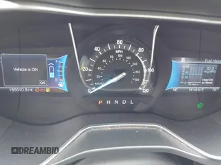 2016 Ford Fusion SE Hybrid with VIN 3FA6P0LU5GR235241, listed as a IAAI auction lot 41697504 with 165,510 mi miles. Bid and sale history available at carsss.com. Image 7.