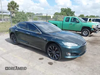 2013 Tesla Model S with VIN 5YJSA1CN0DFP27472, listed as a IAAI auction lot 42176244 with 149,649 mi miles. Bid and sale history available at carsss.com. Image 1.