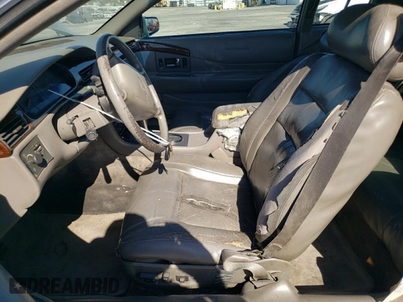 1999 Cadillac Eldorado z VIN 1G6EL12Y0XU604529, wystawiony jako Copart lot #77620004 z przebiegiem 246 032 mil mil oraz Szkoda całkowita • Salvage title. Historia ofert i sprzedaży dostępna na DreamBid. Obrazek 7.