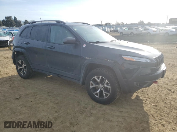 2017 Jeep Cherokee Trailhawk L Plus with VIN 1C4PJMBB1HW518788, listed as a Copart auction lot 49539005 with 237,662 mi miles and Salvage Title. Bid and sale history available at carsss.com. Image 4.