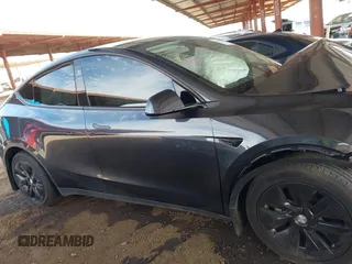 2024 Tesla Model Y with VIN 7SAYGDED9RF053203, listed as a IAAI auction lot 41906729 with Not Provided miles and . Bid and sale history available at DreamBid. Image 13.