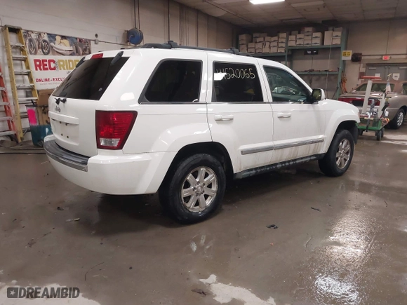 2009 Jeep Grand Cherokee Limited with VIN 1J8GR58K29C553812, listed as a IAAI auction lot 41520065 with 203,595 mi miles. Bid and sale history available at carsss.com. Image 4.