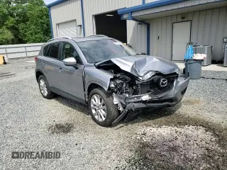 2014 Mazda CX-5 Grand Touring with VIN JM3KE4DY9E0416967, listed as a Copart auction lot 54215285 with 77,296 mi miles and Salvage Title. Bid and sale history available at DreamBid. Image 14.