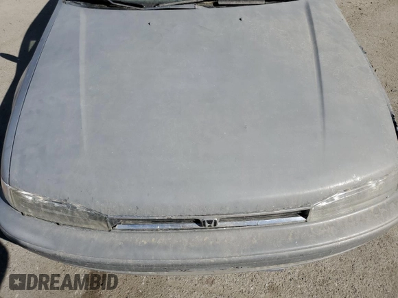 1992 Honda Accord z VIN 1HGCB7254NA015113, wystawiony jako Copart lot #77223284 z przebiegiem 219 007 mil mil oraz Szkoda całkowita • Salvage title. Historia ofert i sprzedaży dostępna na DreamBid. Obrazek 13.