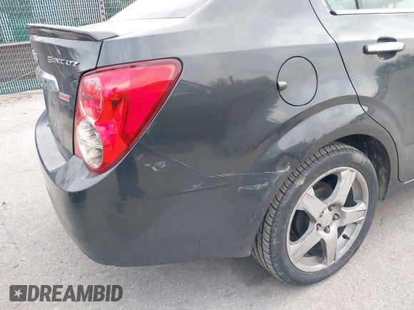 2014 Chevrolet Sonic LTZ with VIN 1G1JE5SB1E4200234, listed as a IAAI auction lot 41850396 with 173,324 mi miles. Bid and sale history available at carsss.com. Image 6.
