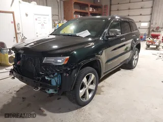 2014 Jeep Grand Cherokee Overland with VIN 1C4RJFCGXEC162109, listed as a IAAI auction lot 41943979 with 147,788 mi miles. Bid and sale history available at carsss.com. Image 23.
