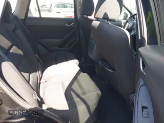 2016 Mazda CX-5 Touring z VIN JM3KE4CY2G0656270, wystawiony jako IAAI lot #42344489 z przebiegiem 60 449 mil mil oraz . Historia ofert i sprzedaży dostępna na DreamBid. Obrazek 8.