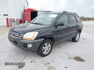 2007 Kia Sportage LX with VIN KNDJE723077397667, listed as a IAAI auction lot 42011122 with 218,744 mi miles and . Bid and sale history available at carsss.com. Image 2.