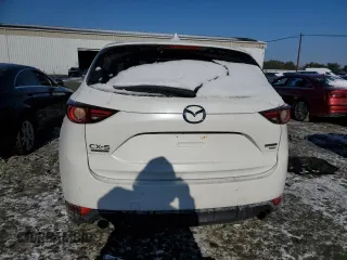 2021 Mazda CX-5 Signature with VIN JM3KFBEY5M0447759, listed as a Copart auction lot 42565535 with 24,175 mi miles and Salvage Title. Bid and sale history available at carsss.com. Image 6.