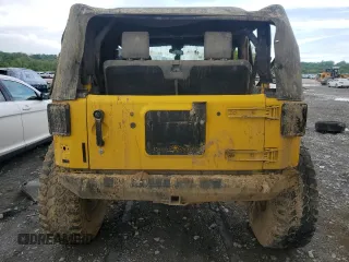 2009 Jeep Wrangler X with VIN 1J4FA24119L754391, listed as a Copart auction lot 56067805 with 118,117 mi miles and Salvage title. Bid and sale history available at DreamBid. Image 6.
