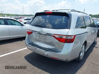 2011 Honda Odyssey Touring with VIN 5FNRL5H99BB058448, listed as a IAAI auction lot 42651432 with 208,581 mi miles and . Bid and sale history available at DreamBid. Image 4.