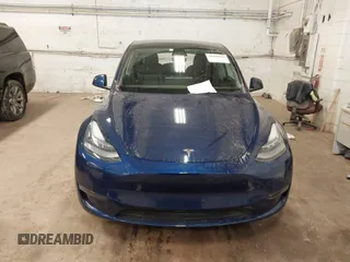 2021 Tesla Model Y Long Range with VIN 5YJYGDEE2MF185945, listed as a IAAI auction lot 41599029 with 53,815 mi miles and . Bid and sale history available at DreamBid. Image 13.