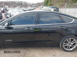 2019 Ford Fusion Hybrid Titanium with VIN 3FA6P0RU4KR144445, listed as a IAAI auction lot 42059840 with 90,617 mi miles. Bid and sale history available at carsss.com. Image 15.