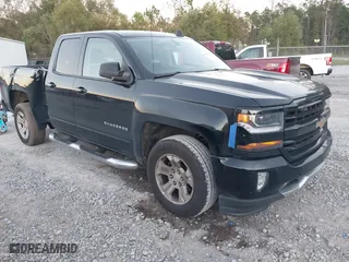 2018 Chevrolet Silverado 1500 LT with VIN 1GCVKREH9JZ115468, listed as a IAAI auction lot 40924644 with 213,059 mi miles. Bid and sale history available at carsss.com. Image 1.