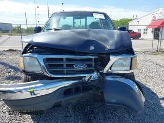 2000 Ford F-150 XL with VIN 1FTZF1828YNC09020, listed as a IAAI auction lot 42034099 with 167,692 mi miles and . Bid and sale history available at DreamBid. Image 12.