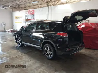 2018 Toyota RAV4 XLE with VIN 2T3WFREV1JW471931, listed as a IAAI auction lot 41332851 with 123,657 mi miles. Bid and sale history available at carsss.com. Image 3.
