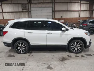 2022 Honda Pilot Touring 7-Passenger with VIN 5FNYF6H63NB063857, listed as a IAAI auction lot 41936941 with 54,424 mi miles. Bid and sale history available at carsss.com. Image 12.