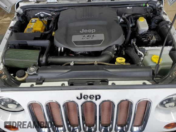 2013 Jeep Wrangler Rubicon 10th Anniversary z VIN 1C4BJWCGXDL543958, wystawiony jako Copart lot #58492255 z przebiegiem 94 455 mil mil oraz Szkoda całkowita • Salvage title. Historia ofert i sprzedaży dostępna na DreamBid. Obrazek 11.