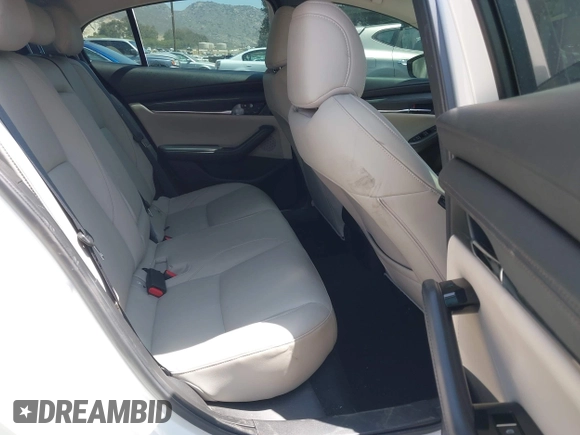 2023 Mazda 3 S Carbon Edition with VIN 3MZBPACM1PM356552, listed as a IAAI auction lot 42603574 with 20,092 mi miles and . Bid and sale history available at DreamBid. Image 8.