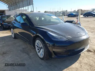 2022 Tesla Model 3 with VIN 5YJ3E1EA6NF321474, listed as a IAAI auction lot 41482733 with 60,844 mi miles. Bid and sale history available at carsss.com. Image 1.