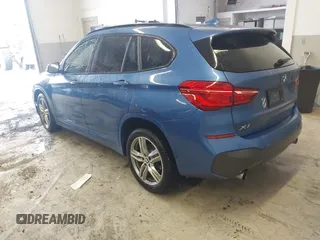 2019 BMW X1 xDrive28i with VIN WBXHT3C53K5L36690, listed as a IAAI auction lot 42012992 with 70,339 mi miles. Bid and sale history available at carsss.com. Image 3.