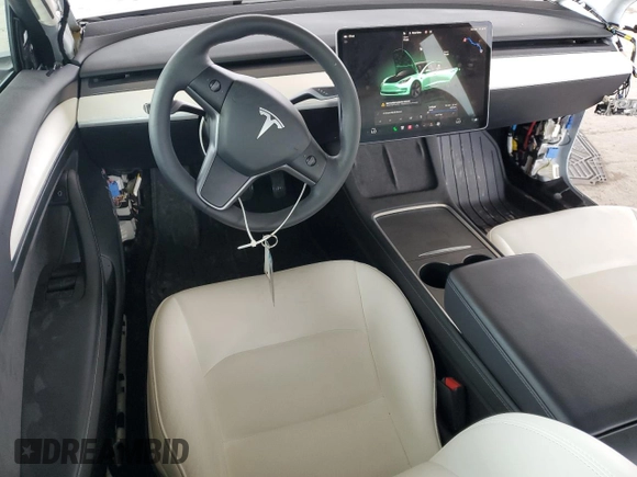 2023 Tesla Model 3 z VIN 5YJ3E1EA8PF471458, wystawiony jako Copart lot #60953035 z przebiegiem 26 773 mil mil oraz Szkoda całkowita • Salvage title. Historia ofert i sprzedaży dostępna na DreamBid. Obrazek 8.