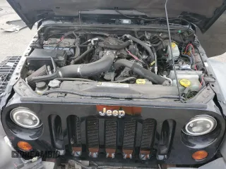 2011 Jeep Wrangler Rubicon with VIN 1J4BA6D12BL507652, listed as a Copart auction lot 69989964 with 127,493 mi miles and Salvage title. Bid and sale history available at DreamBid. Image 11.