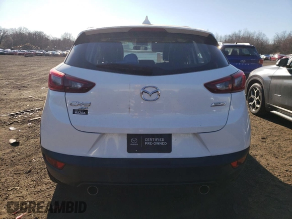 2016 Mazda CX-3 Touring z VIN JM1DKFC77G0136787, wystawiony jako Copart lot #50697845 z przebiegiem 96 277 mil mil oraz Szkoda całkowita • Salvage title. Historia ofert i sprzedaży dostępna na DreamBid. Obrazek 6.