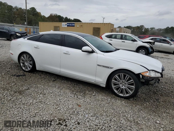 2013 Jaguar XJ with VIN SAJWA2GB8DLV52975, listed as a Copart auction lot 79123644 with 160,473 mi miles and Salvage Title. Bid and sale history available at carsss.com. Image 4.