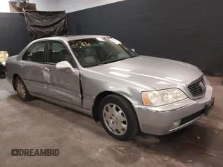 2004 Acura RL w/Navigation System z VIN JH4KA96604C001061, wystawiony jako IAAI lot #41808266 z przebiegiem 155 168 mil mil oraz . Historia ofert i sprzedaży dostępna na DreamBid. Obrazek 1.