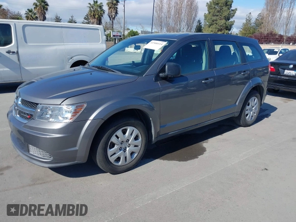 2013 Dodge Journey SE with VIN 3C4PDCAB7DT730744, listed as a IAAI auction lot 41900114 with 186,086 mi miles and . Bid and sale history available at DreamBid. Image 2.