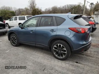 2016 Mazda CX-5 Grand Touring with VIN JM3KE4DY7G0761594, listed as a Copart auction lot 51514595 with 58,250 mi miles and Salvage Title. Bid and sale history available at DreamBid. Image 2.