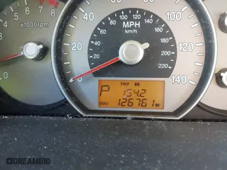 2007 Kia Rondo LX with VIN KNAFG526977114033, listed as a IAAI auction lot 40967531 with 126,761 mi miles. Bid and sale history available at carsss.com. Image 7.