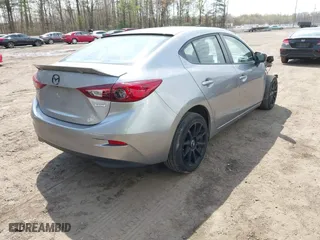 2016 Mazda Mazda3 i Sport with VIN JM1BM1T71G1335980, listed as a IAAI auction lot 42003186 with 131,015 mi miles. Bid and sale history available at carsss.com. Image 4.