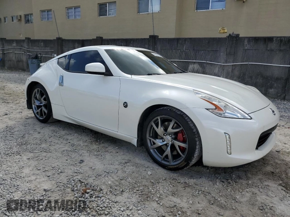 2014 Nissan 370Z Touring with VIN JN1AZ4EH6EM630690, listed as a Copart auction lot 43939795 with 66,797 mi miles and Salvage Title. Bid and sale history available at carsss.com. Image 4.